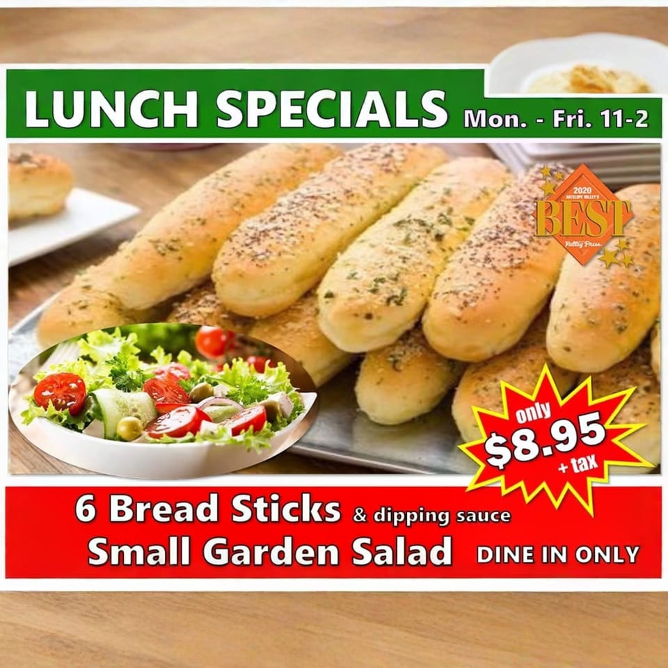 Lunch special advertisement featuring breadsticks, a garden salad, and pricing details.